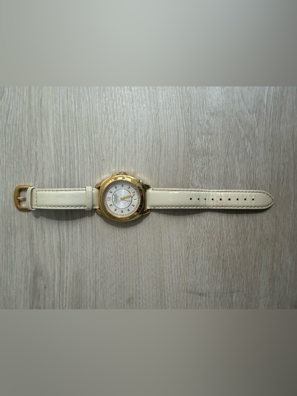 Coach Women's Gold Tone Watch with Cream Leather Strap